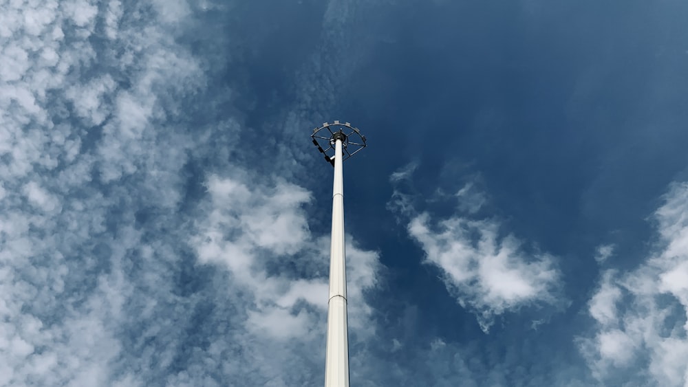 a tall white pole with a sky background