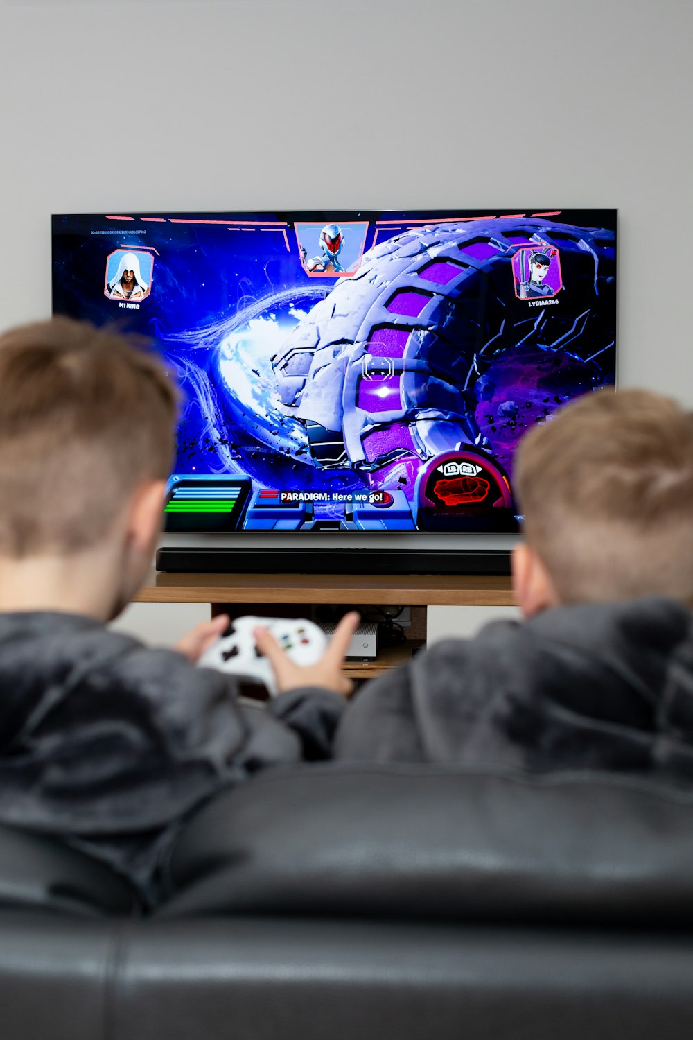 a boy is playing a video game on the television