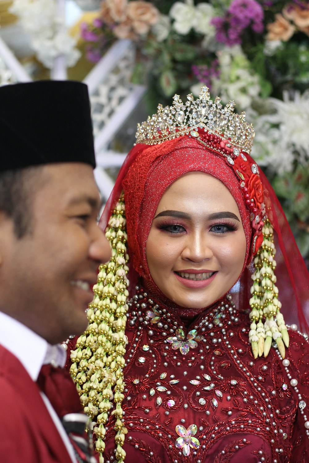 a man and a woman dressed in traditional garb