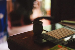 Close-up of a stylish gadget displayed on a wooden table with soft natural light.