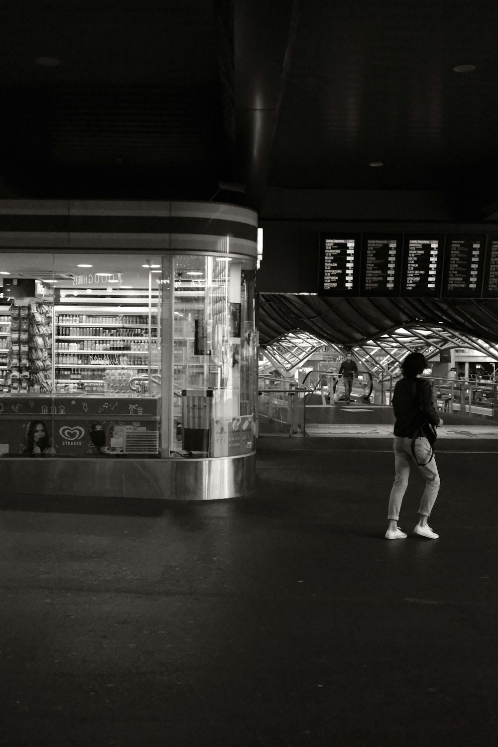 a person standing in front of a train station