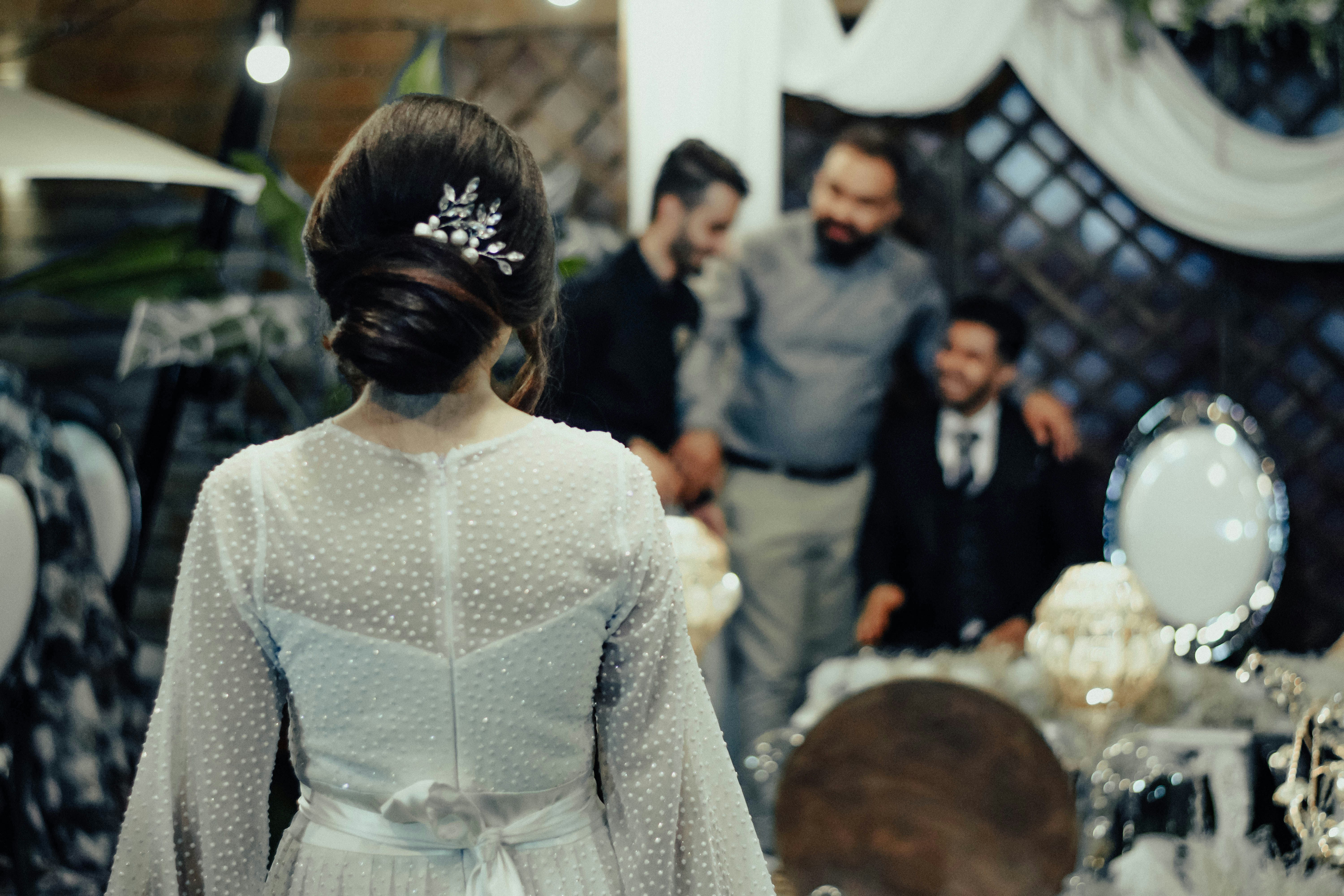 Woman in white dress celebrating
