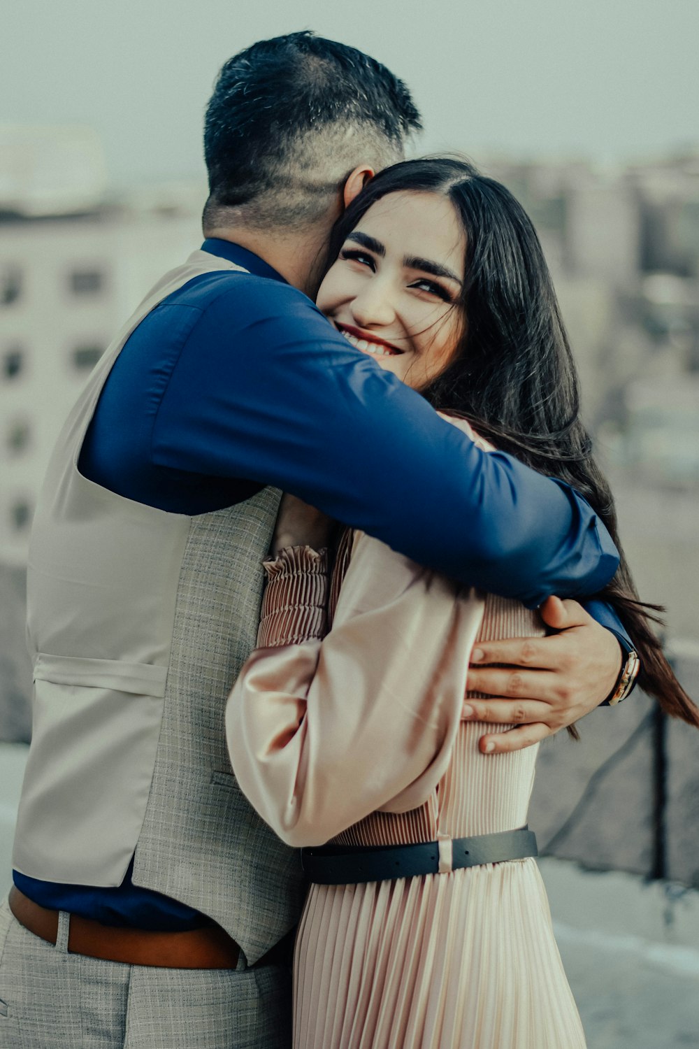 a man and a woman embracing each other