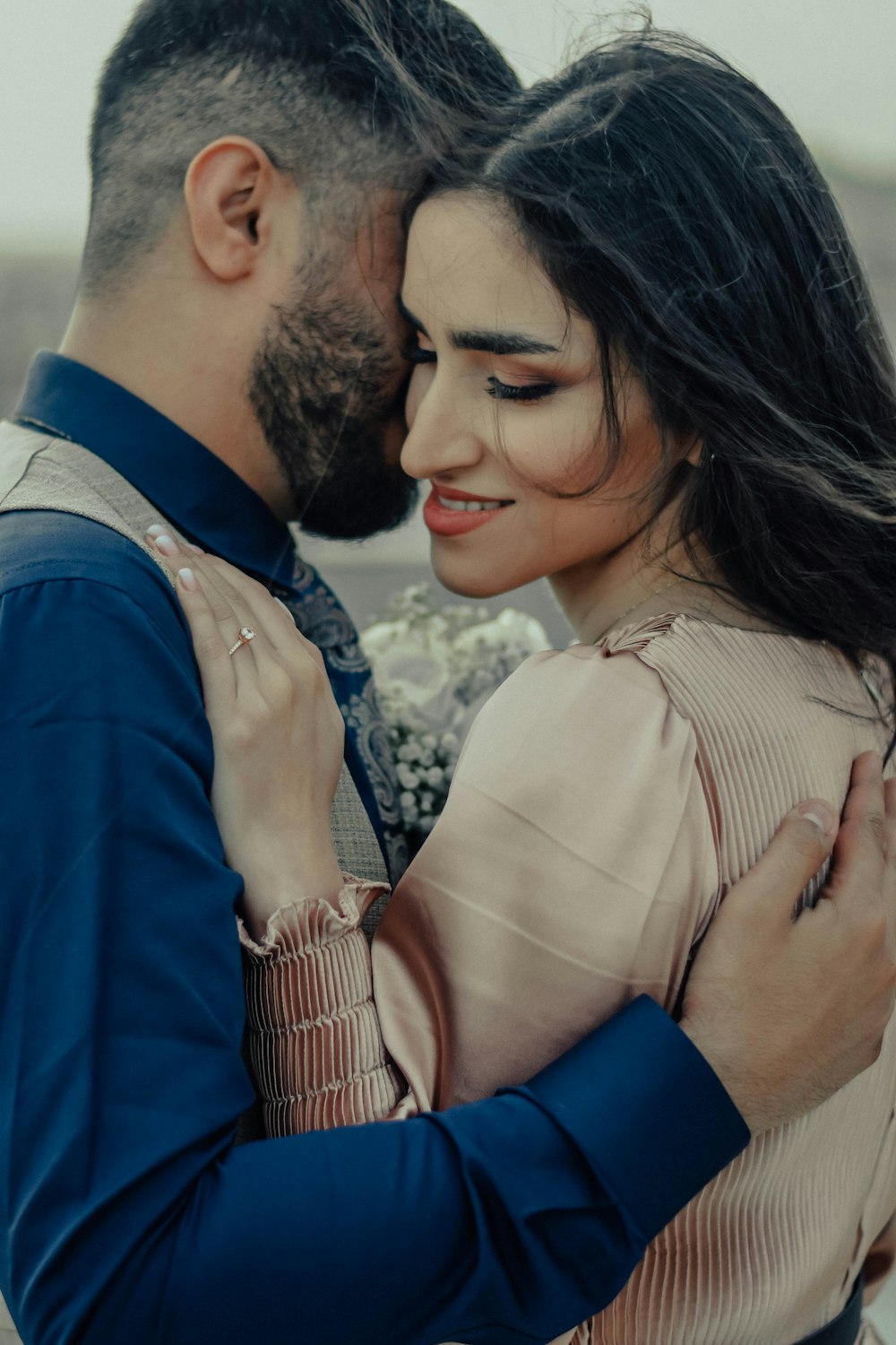 a man and a woman embracing each other