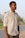a man standing on the side of a road
