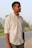 a man standing on the side of a road