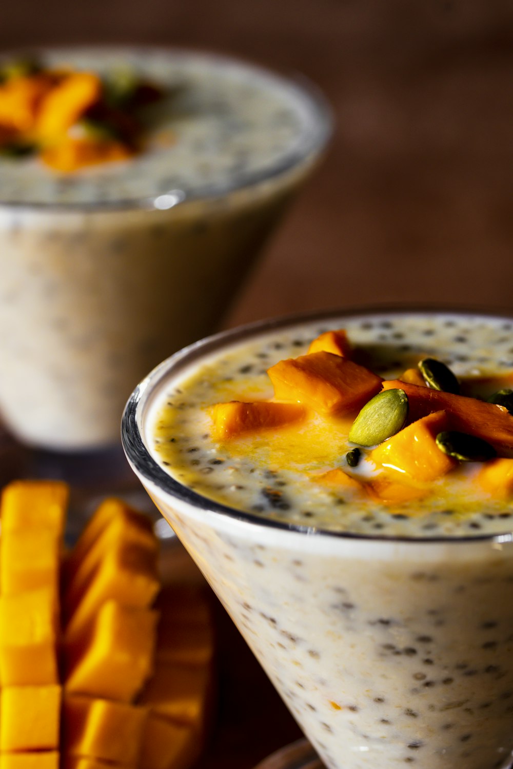 a close up of two glasses of food on a table