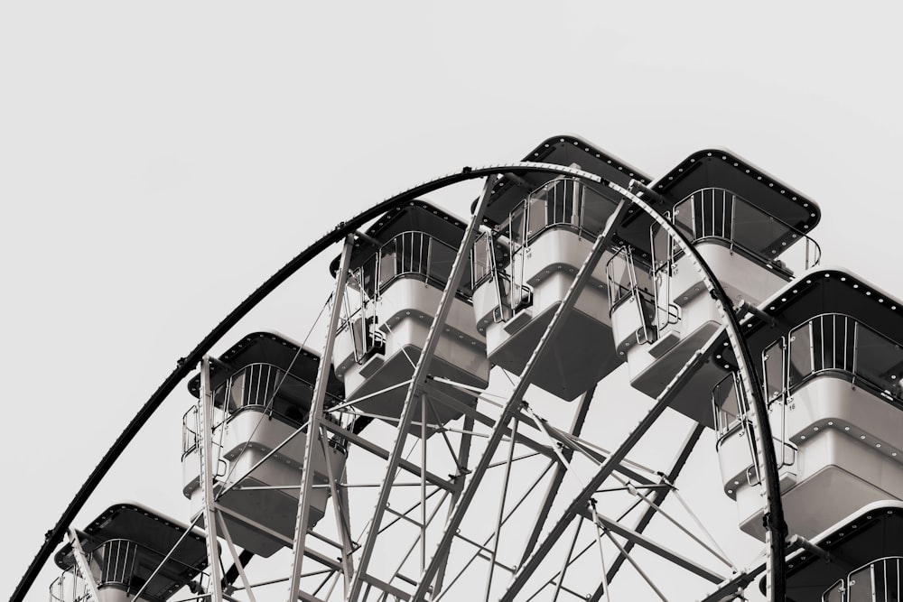 a black and white photo of a ferris wheel