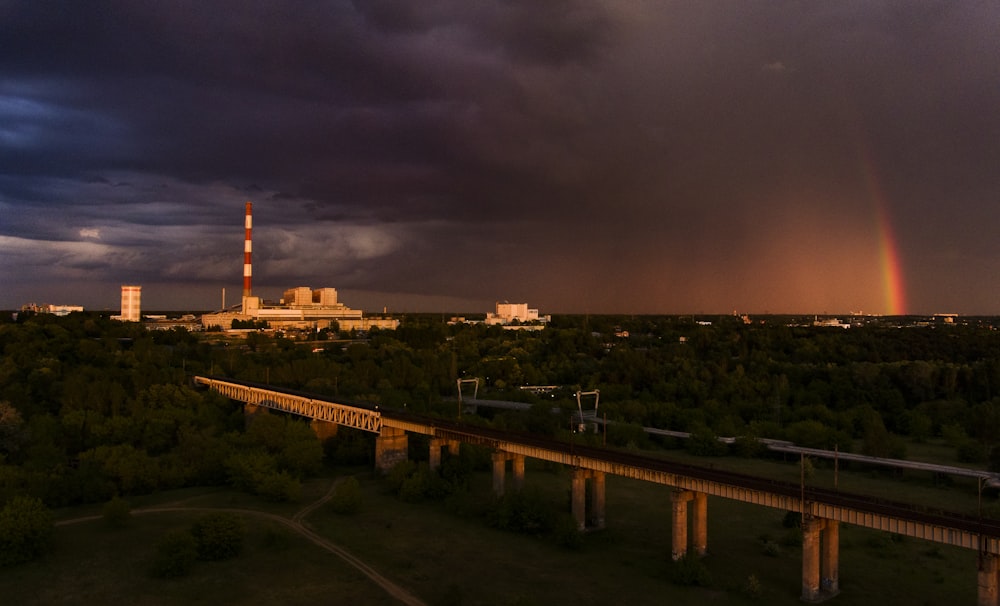 a rainbow in the sky over a city