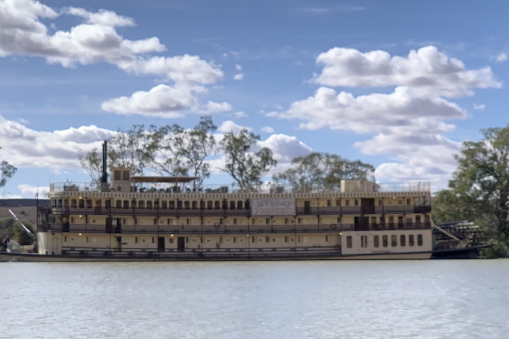 a large boat floating on top of a lake