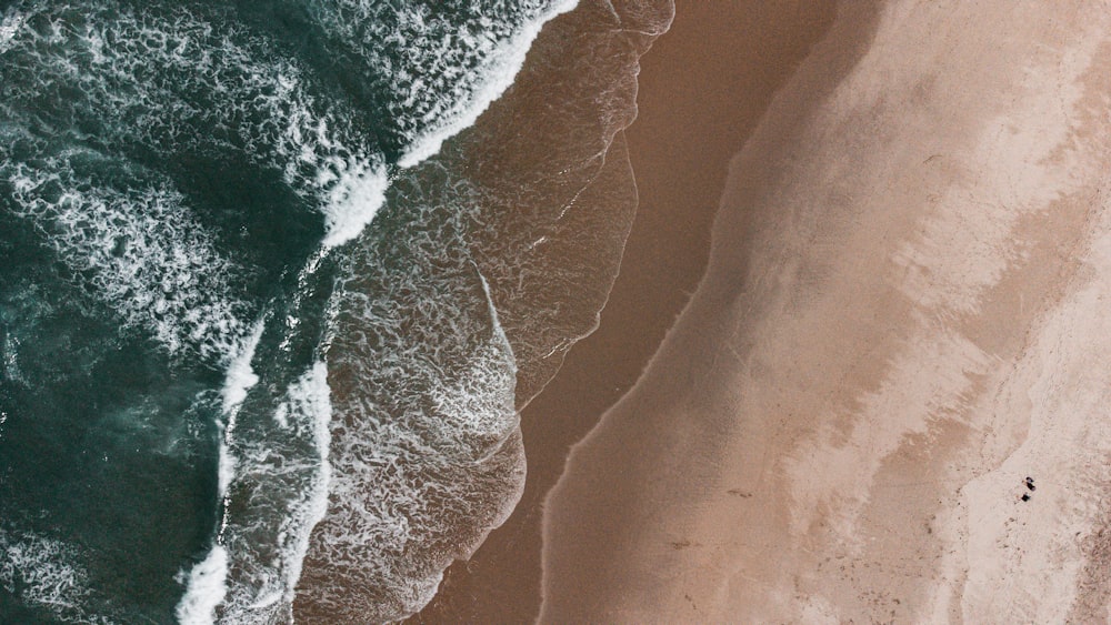 a bird's eye view of a beach and ocean