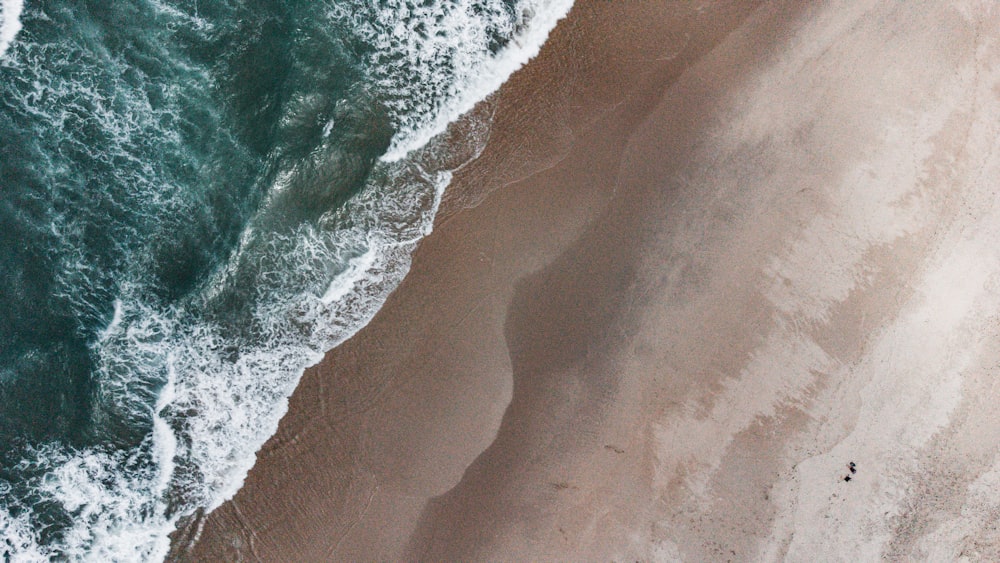 an aerial view of a beach and ocean