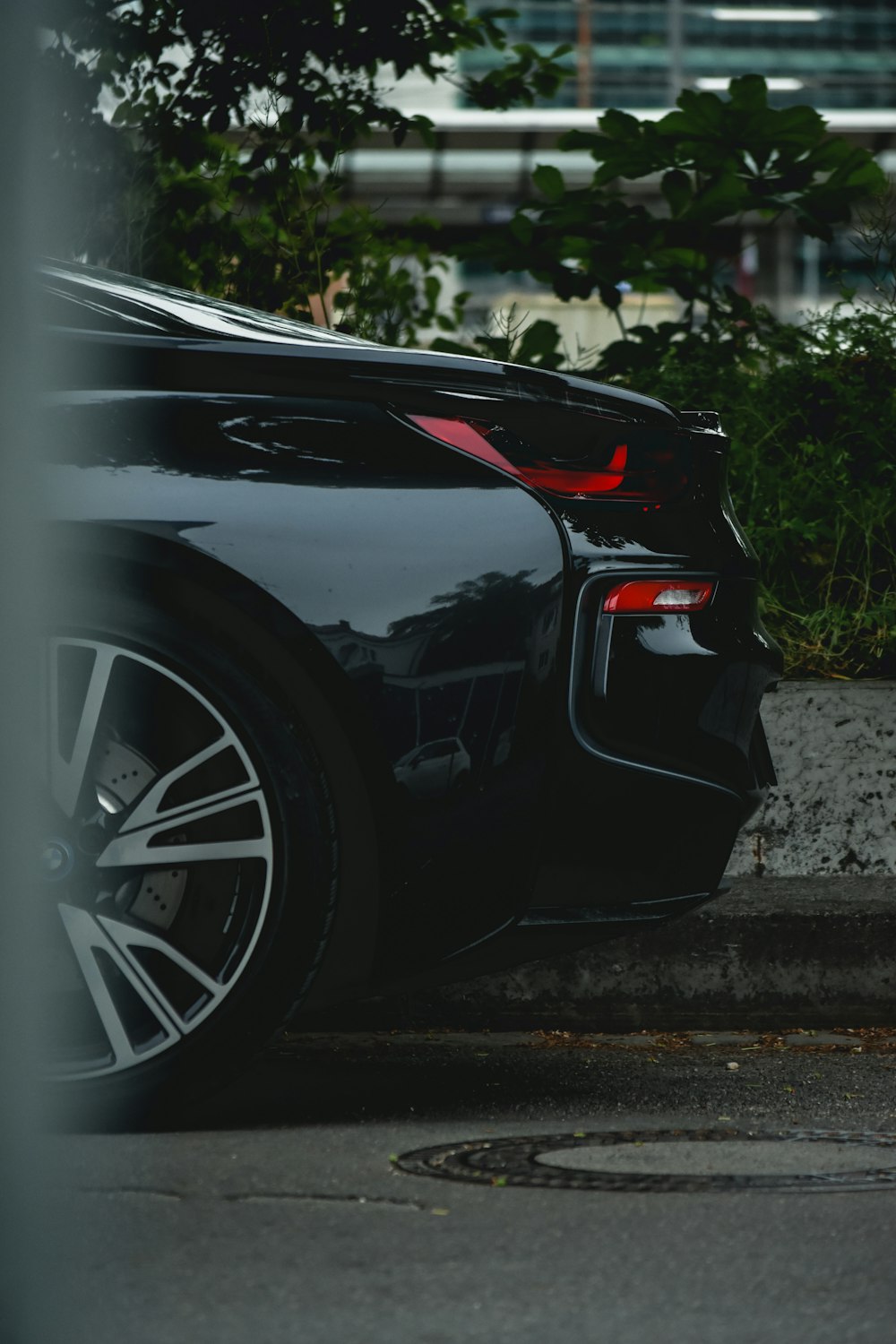 a black sports car parked on the side of the road