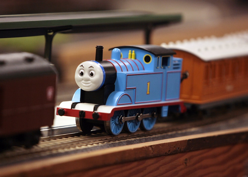 a toy thomas the tank engine on a track