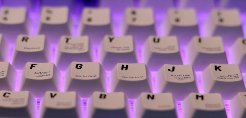 a close up of a keyboard with letters on it