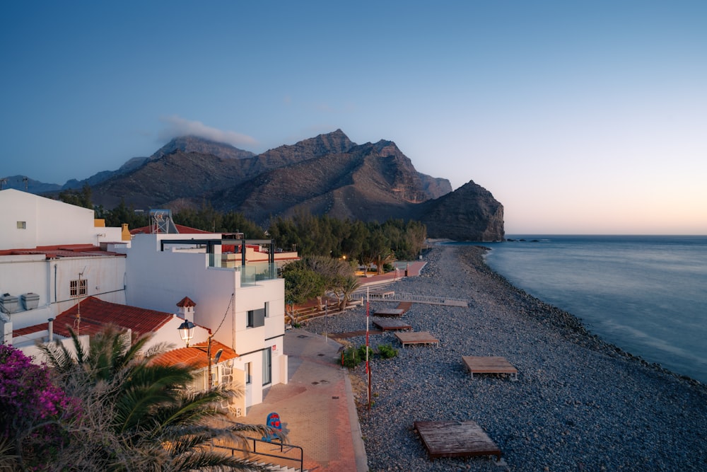 a view of a beach with mountains in the background