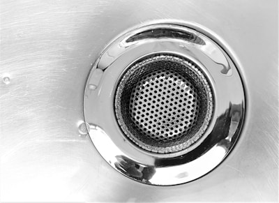 Professional drain cleaning - sink drain close-up