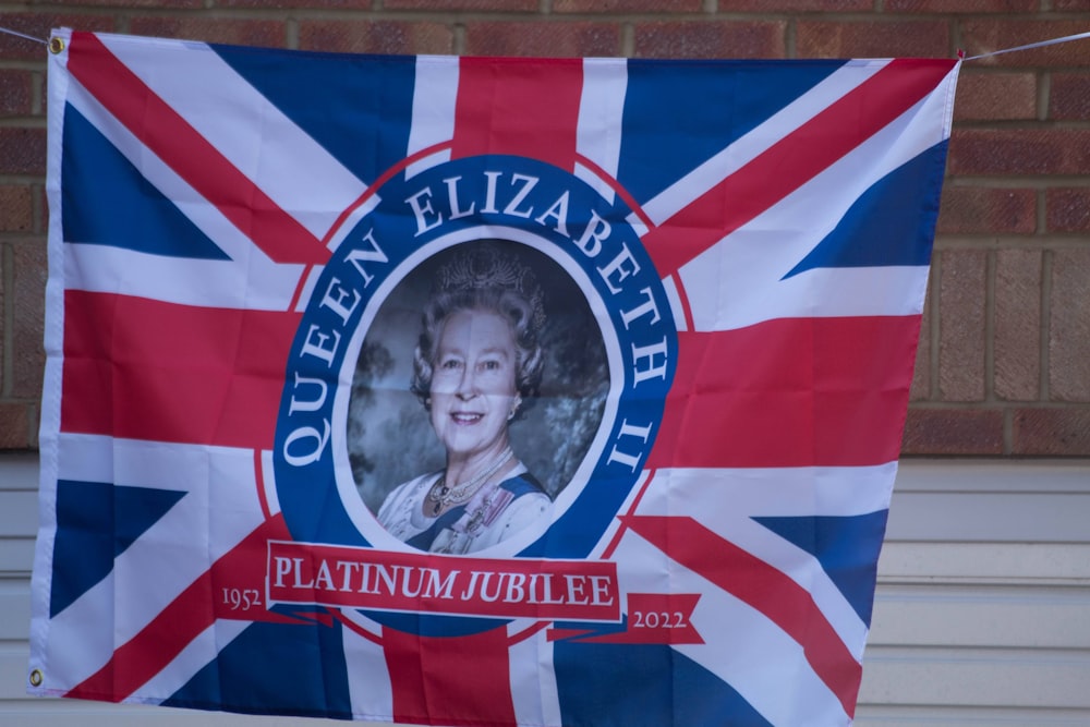 a flag with a picture of queen elizabeth on it
