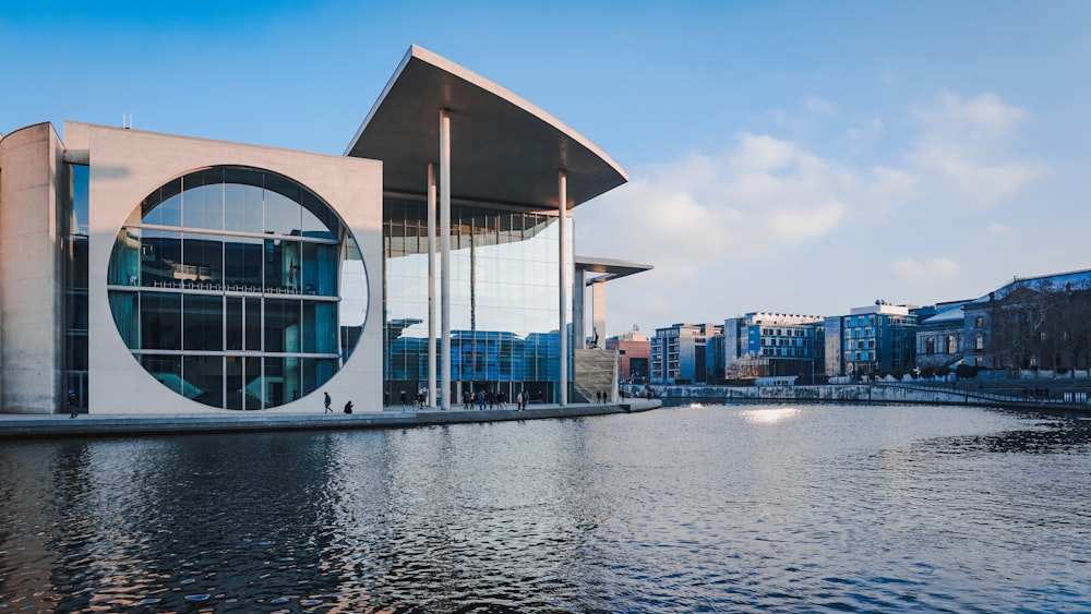 a body of water with a building next to it