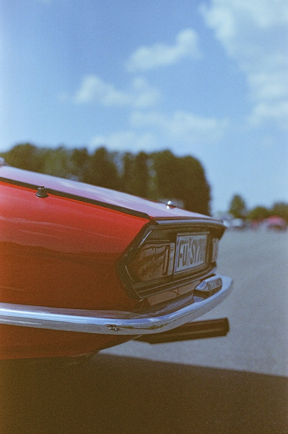 a red car parked on the side of the road