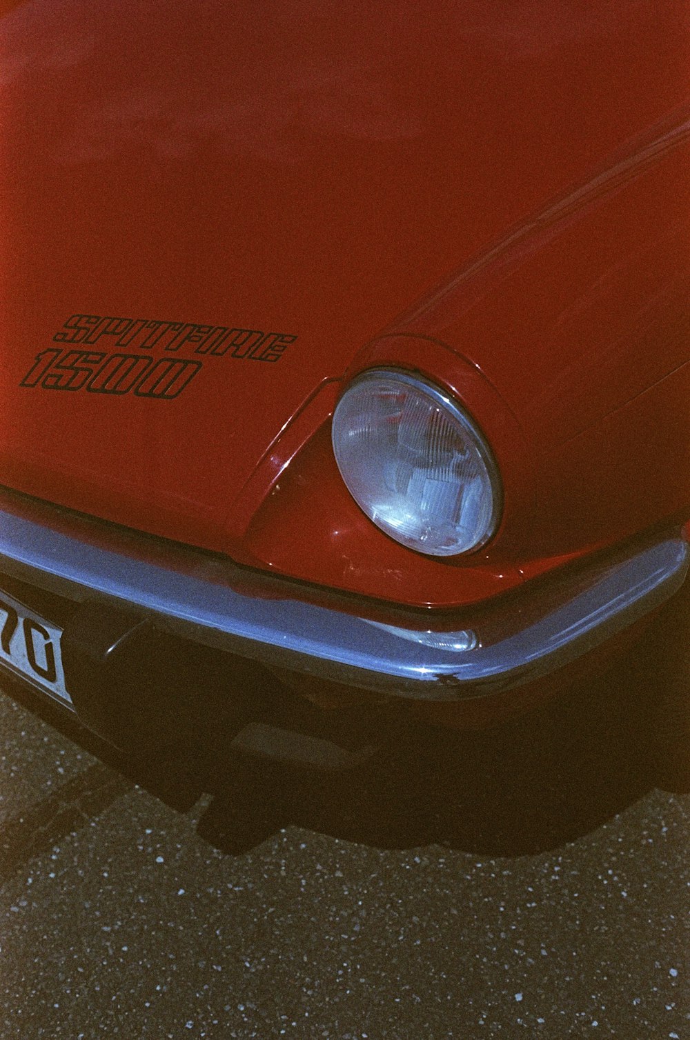 a close up of the front of a red car