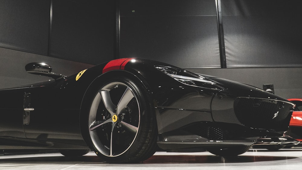 a black sports car parked in a garage