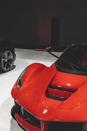 Elevé Group a red sports car is on display at a car show