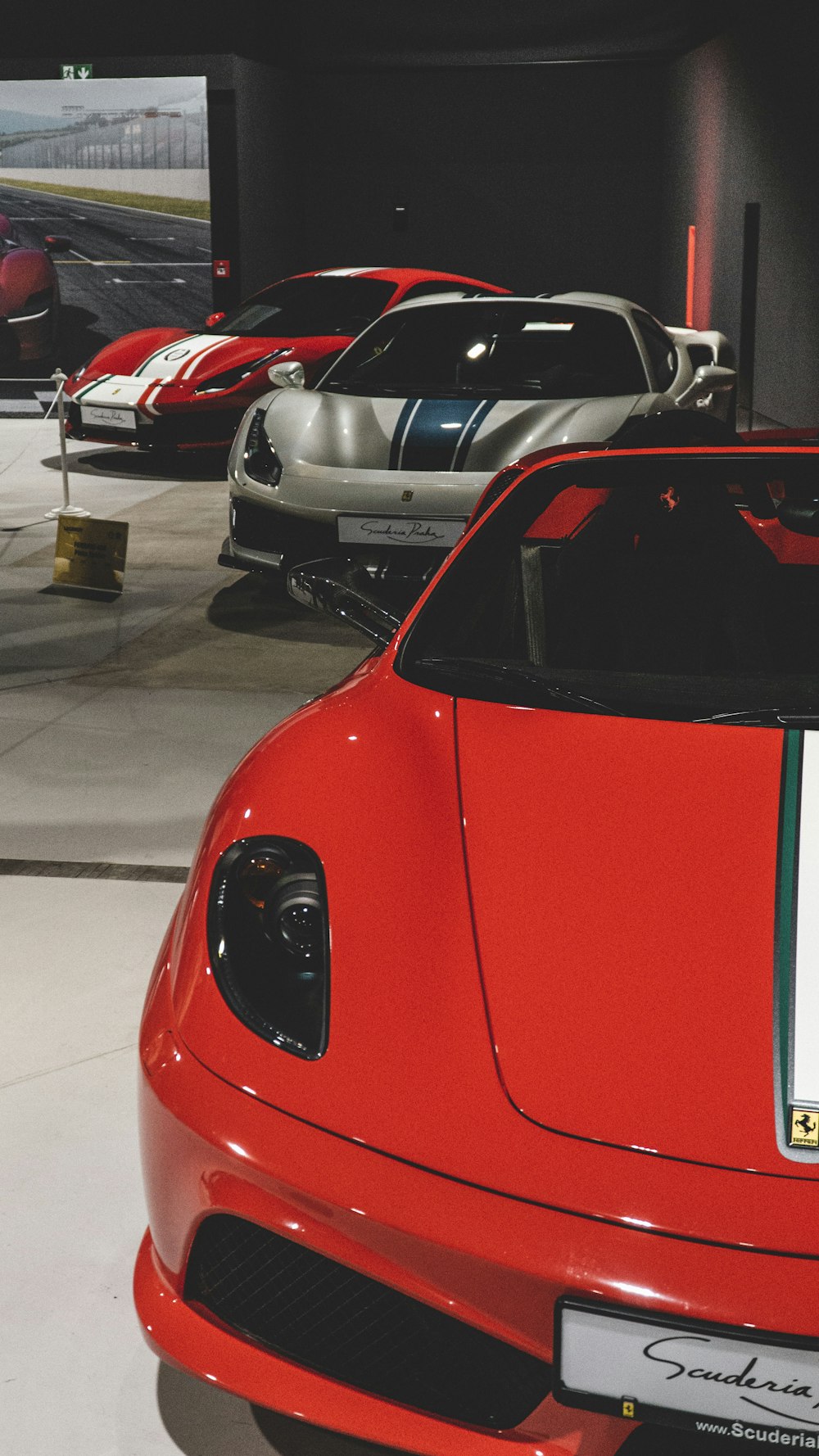 a bunch of cars are parked in a garage