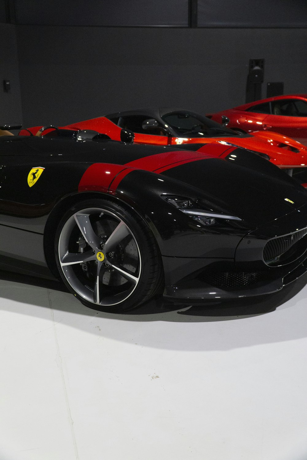 a black and red sports car is on display