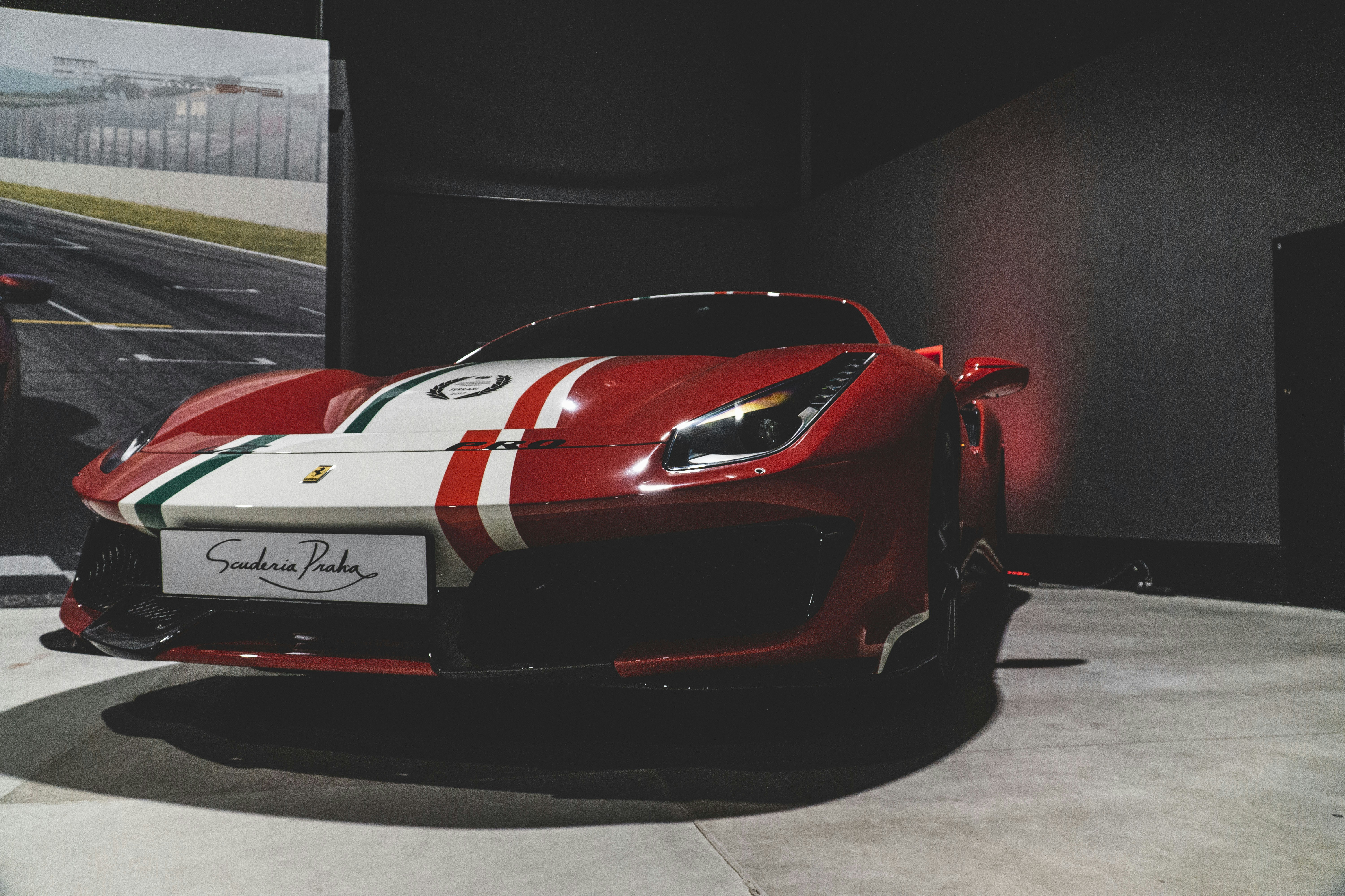 a red and white sports car on display