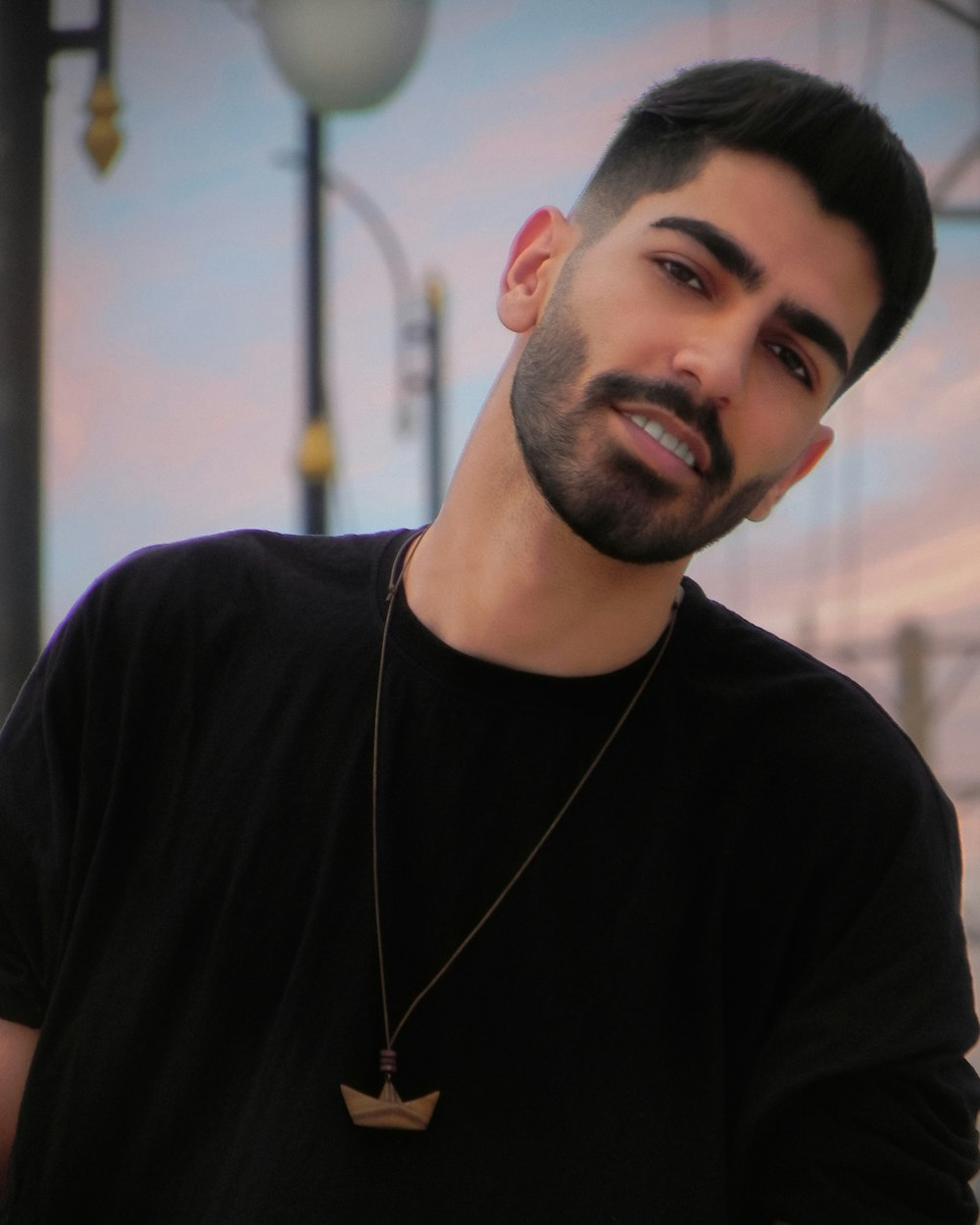 a man with a beard and a black shirt