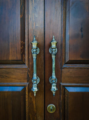 A modern door fitted with new handles and locks, highlighting craftsmanship.
