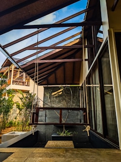 a house with a metal roof and a wooden porch