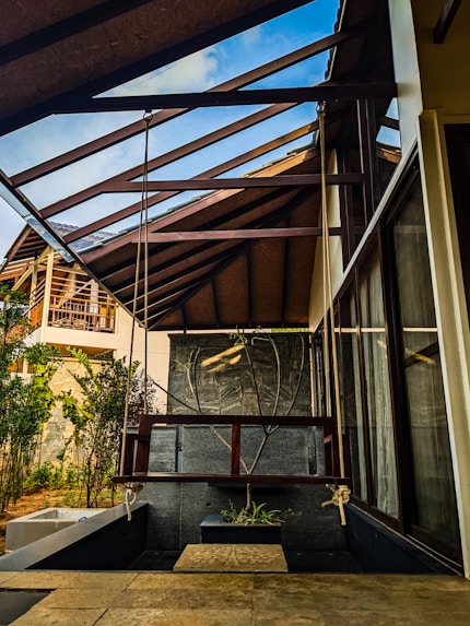 a house with a metal roof and a wooden porch
