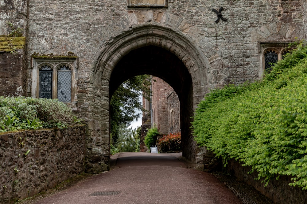 a stone building with an archway leading into it