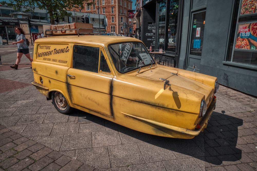 a yellow van parked on the side of a street