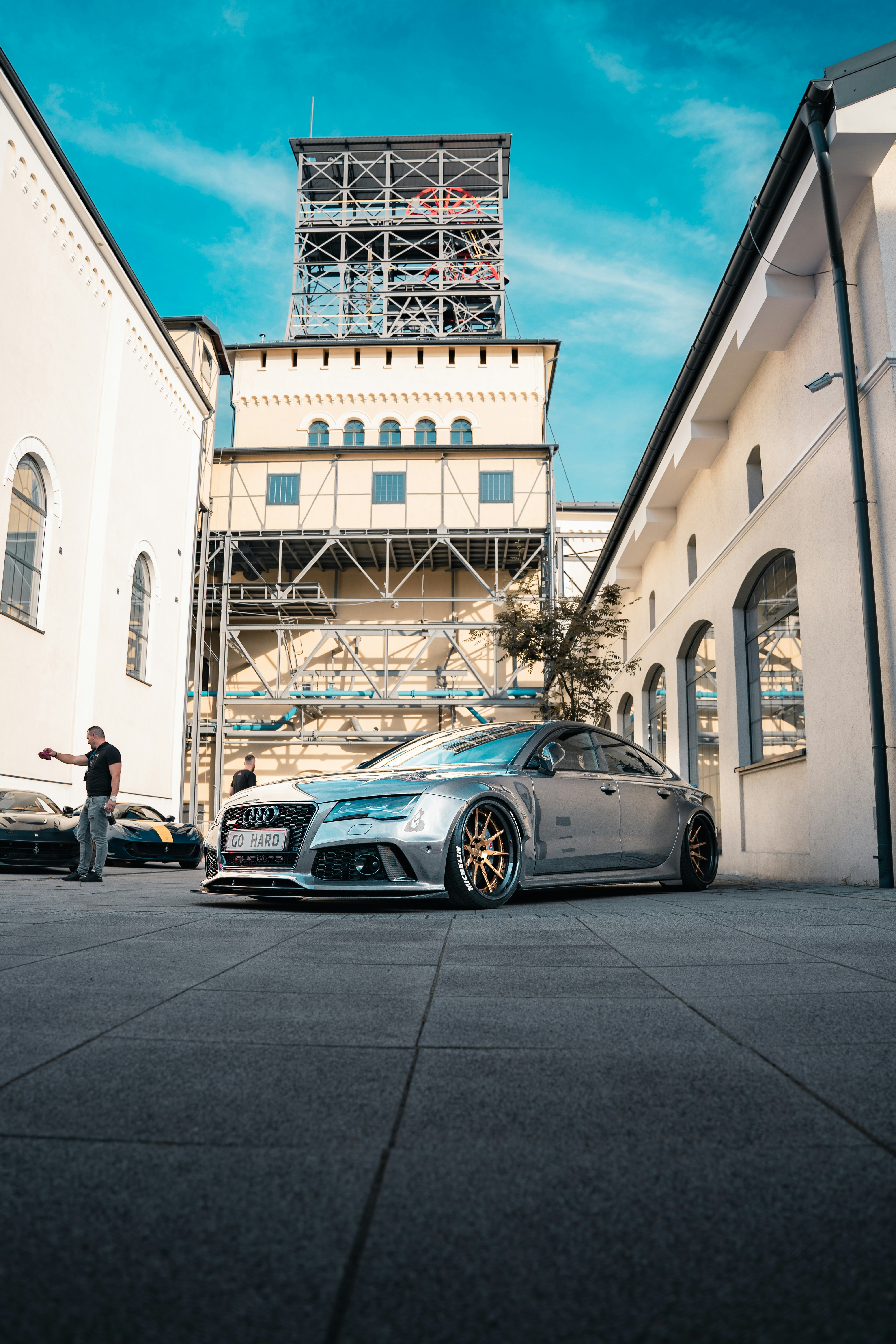 A silver car parked in front of a building photo – Free #photograpgy ...