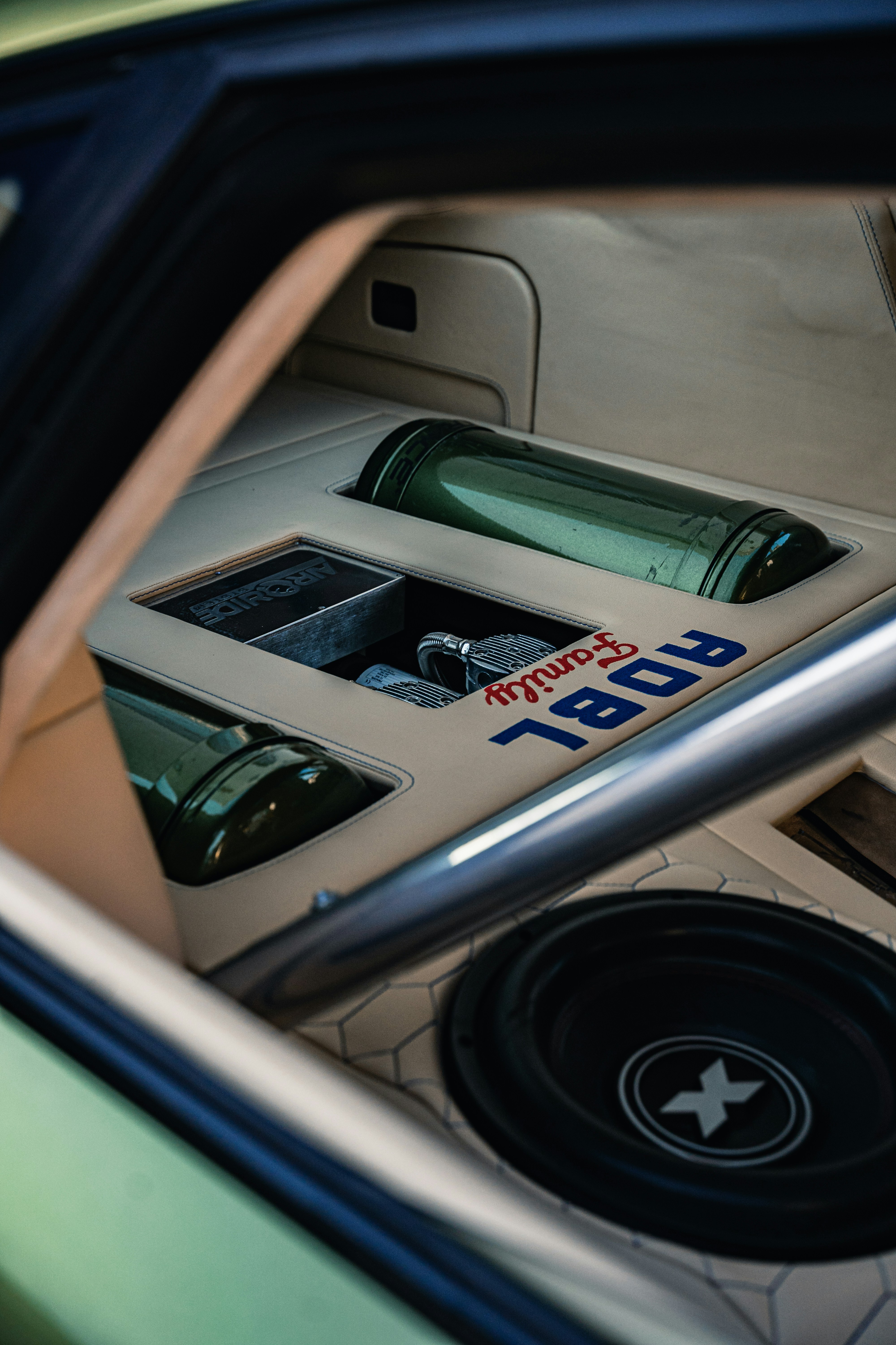 a close up of a car door with a speaker