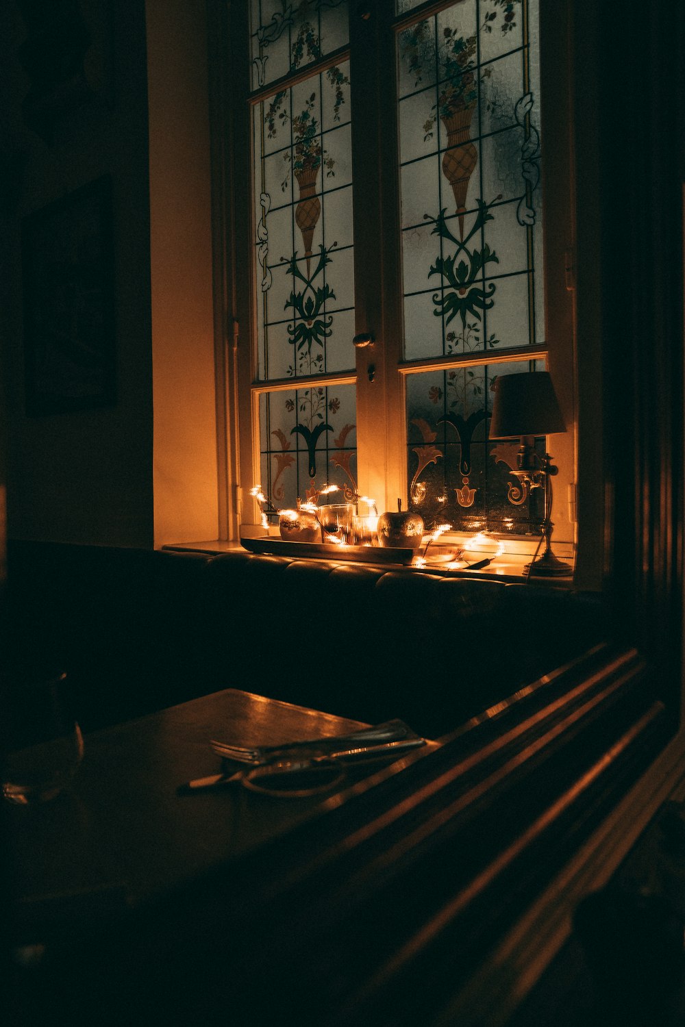 a candle is lit in a dimly lit room