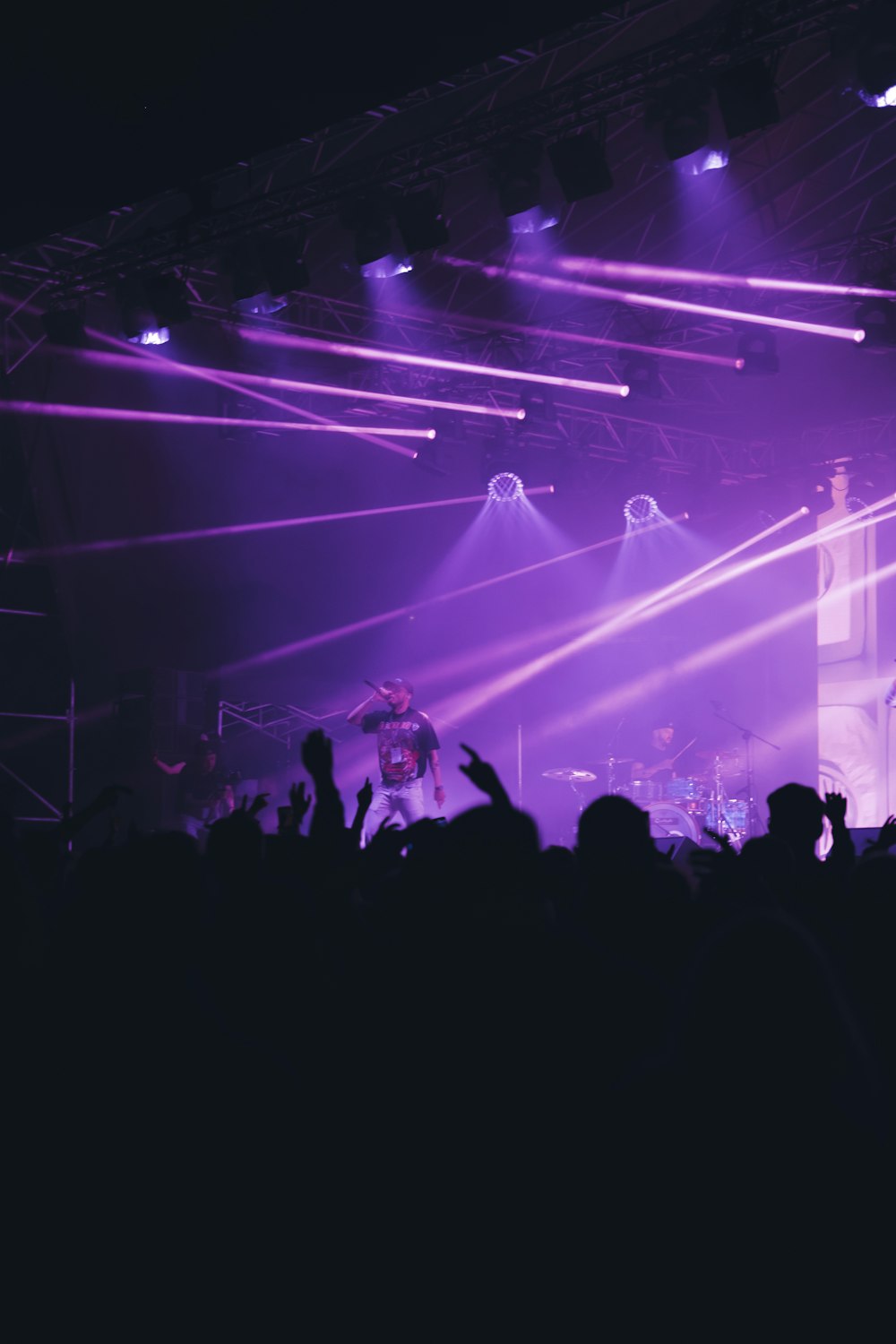 a group of people standing on top of a stage