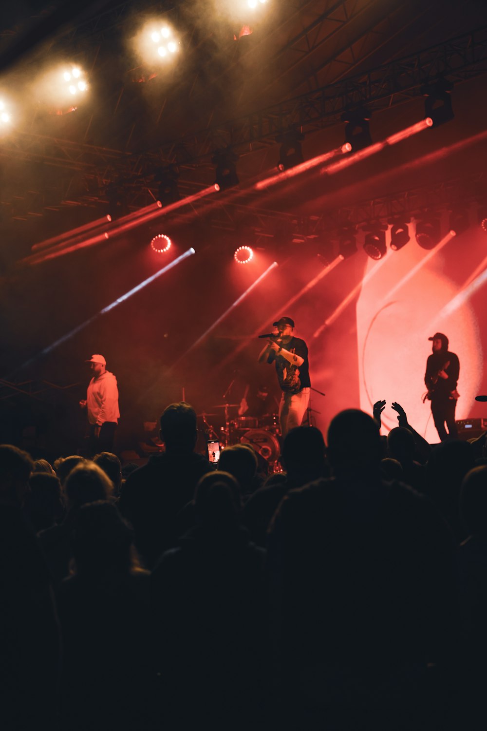 a group of people standing on top of a stage