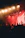 A lively concert scene with El Jawq performing passionately on stage under warm lights.
