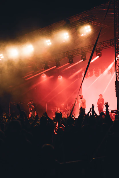 A vibrant stage scene with actors performing passionately under colorful lights