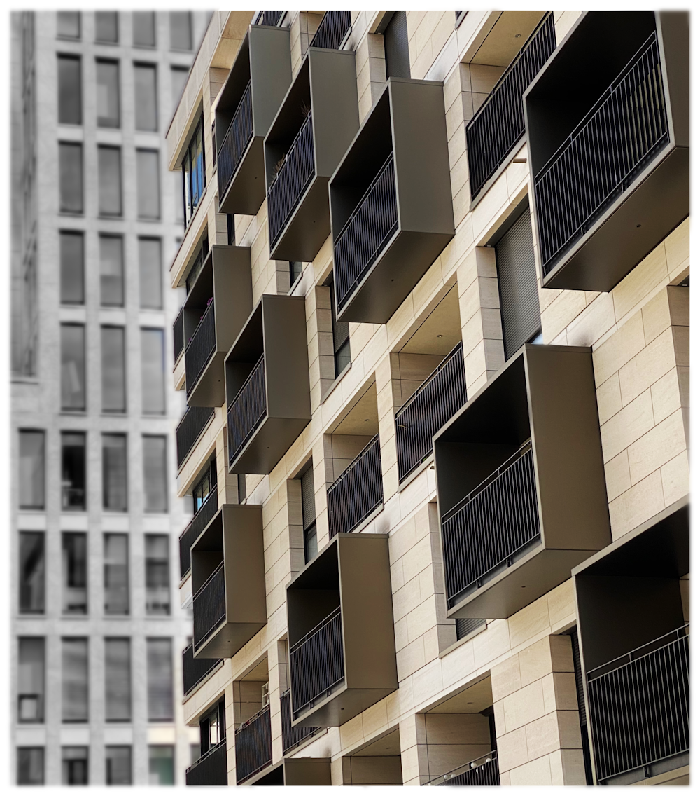 a tall building with lots of windows and balconies