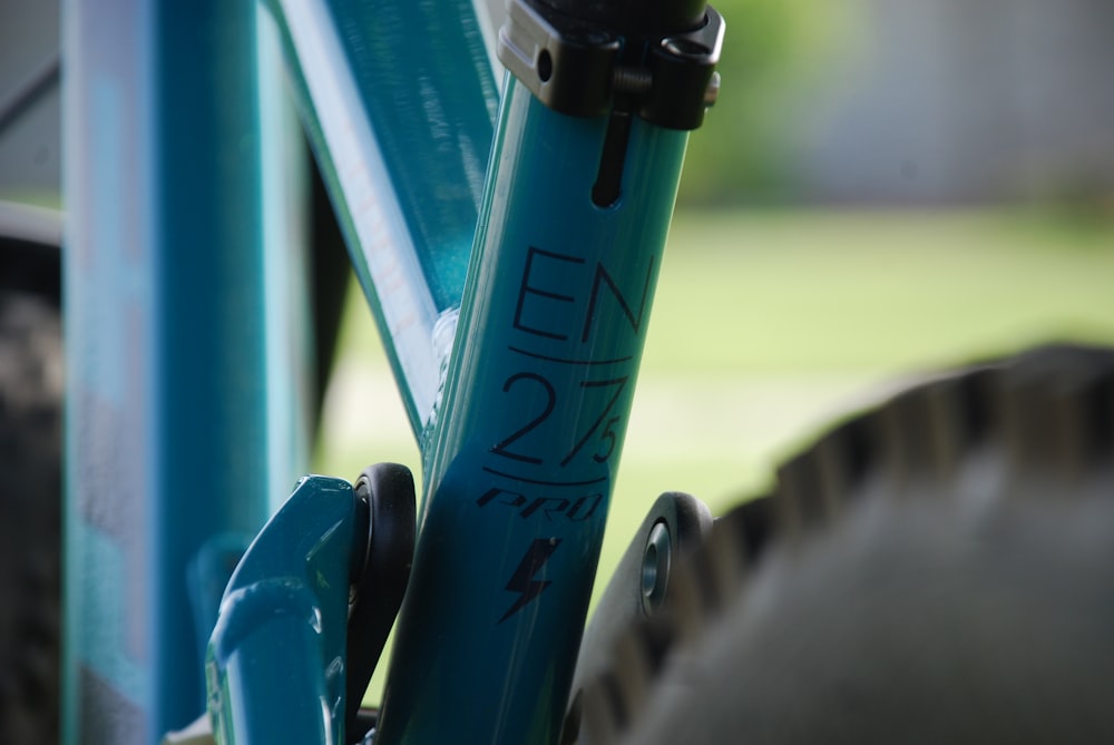 a close up of a blue bike frame