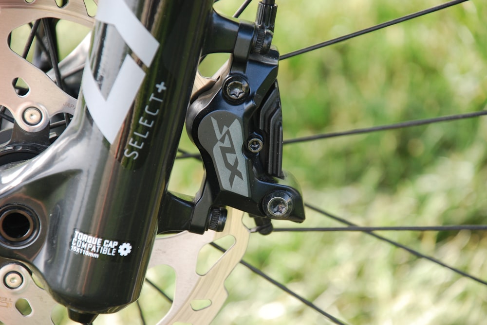 a close up of the front brake of a bike