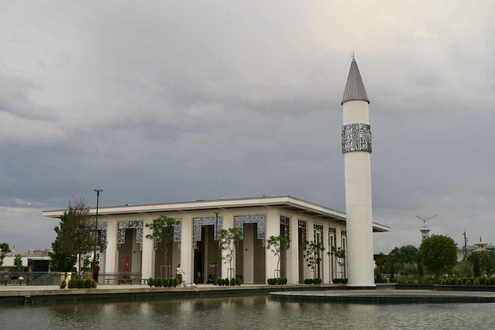 a building with a clock tower in front of it