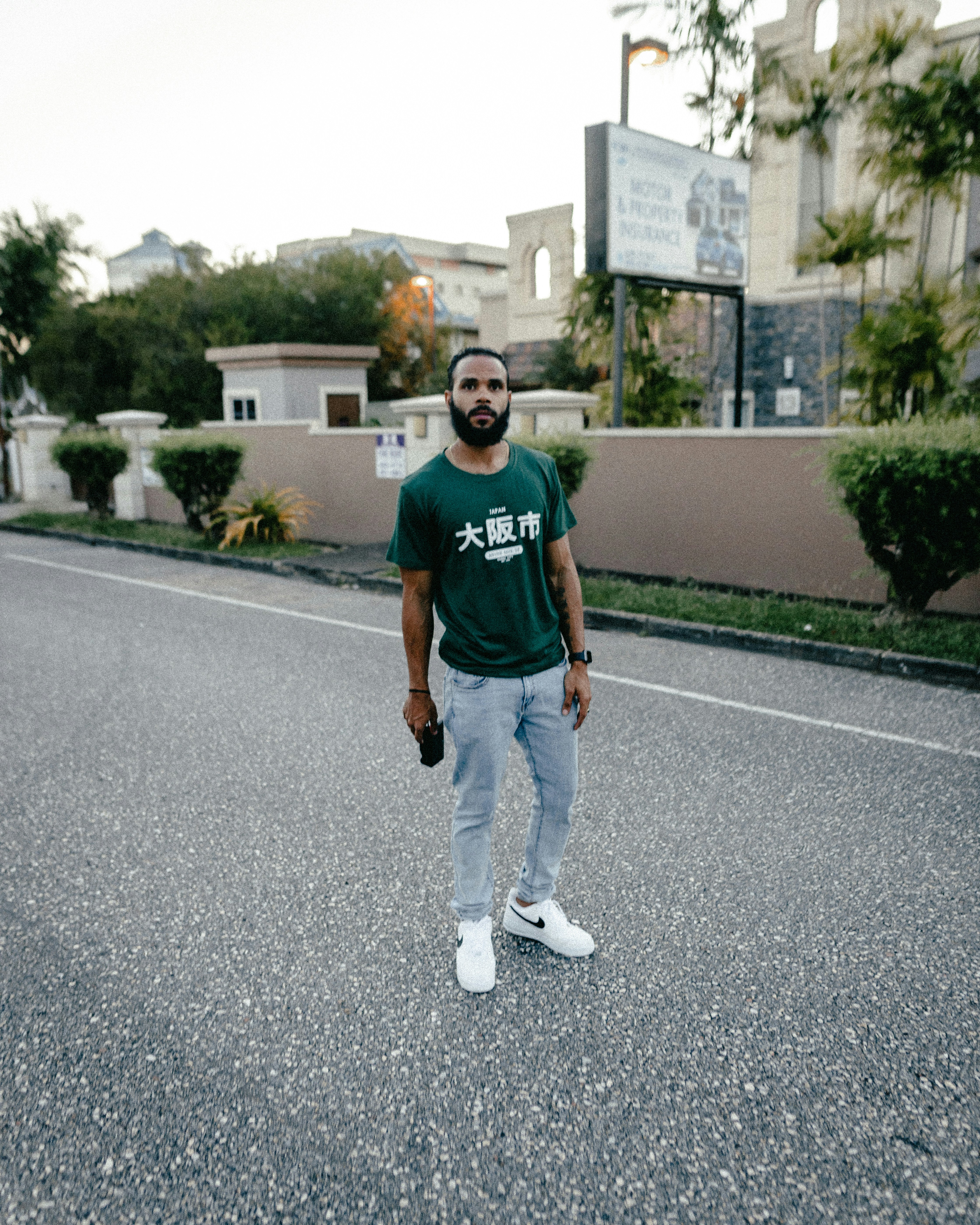 a man standing in the middle of a street