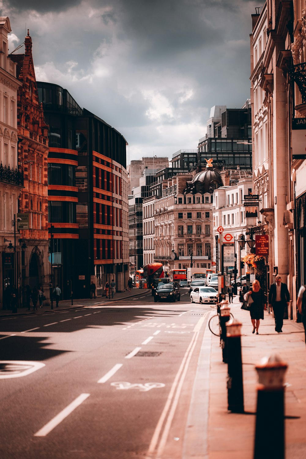 a city street filled with lots of tall buildings