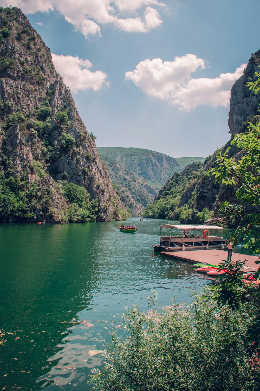 a body of water surrounded by mountains and trees